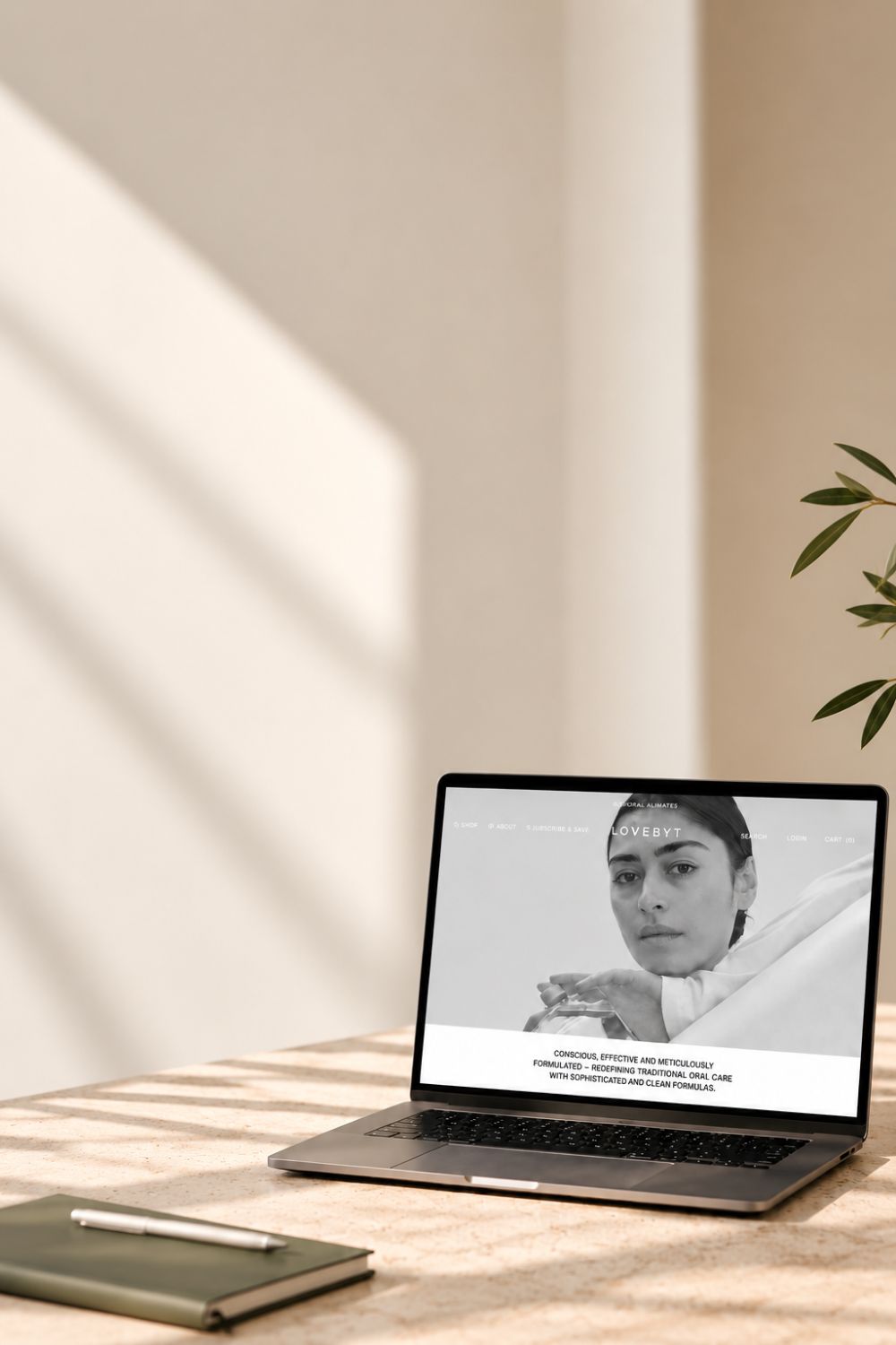 Laptop displaying the Lovebyt e-commerce website on a desk